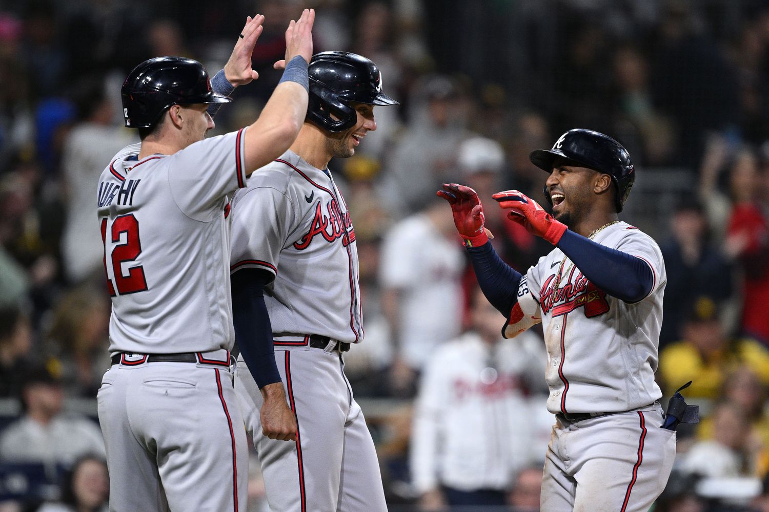 Apr 18, 2023; San Diego, California, USA; Atlanta Braves second baseman Ozzie Albies (right) is congratulated by catcher Sean Murphy (12) after hitting a three-run home run during the eighth inning against the San Diego Padres at Petco Park.